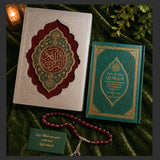 Elegant Islamic wedding gift set featuring exclusive Quran box, The Noble Quran with transliteration and English translation, and red tasbih beads with stainless steel tassels on a beige luxury wedding backdrop.
