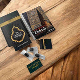 Islamic pilgrim preparation gift box with Umrah guide, Dhul Hijjah book and Sunnah Ajwa dates