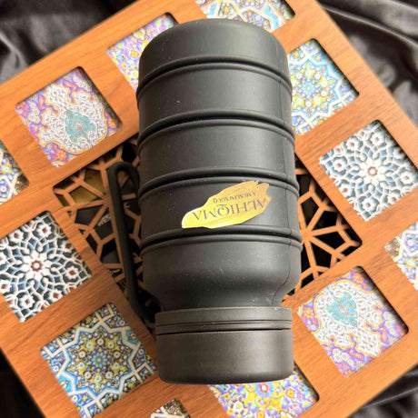 Black refillable water bottle Umrah travel essential Islamic gift set Al Hiqma
